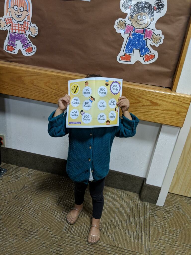 Child With Paper Over Their Face
